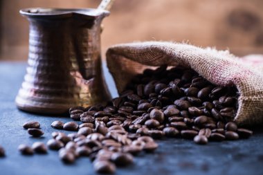 roasted coffee beans and coffee maker