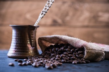 roasted coffee beans and coffee maker