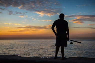 Adam, Malecón, Havana, Küba'da Balık tutma.
