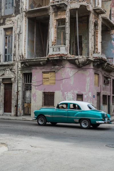 Cuban street scene with people and classic car