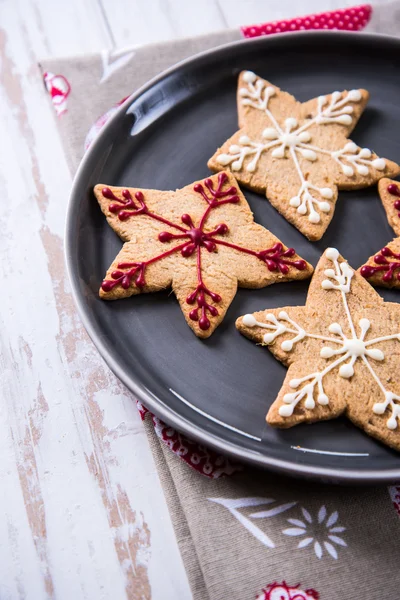 Christmas decorated cookies on plate — Stock Photo, Image