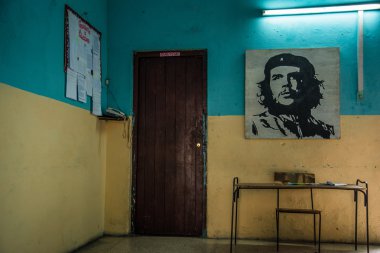 Che Guevara painting on old building wall clipart