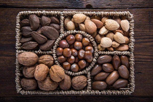 Mixed whole nuts in basket — Stock Photo, Image