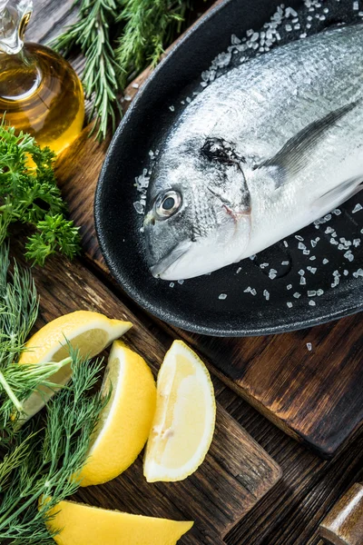 Fresh sea fish in frying pan — Stock Photo, Image