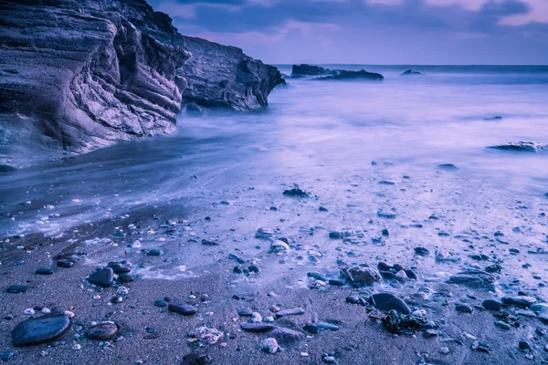 Calm time lapse on beach at sunset — Stock Photo, Image