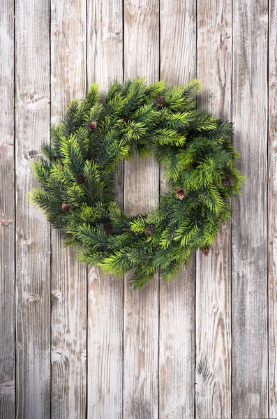 Christmas wreath on wooden door — Stock Photo, Image