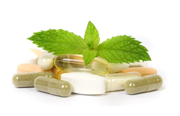 Supplements with a mint leaves — Stock Photo, Image