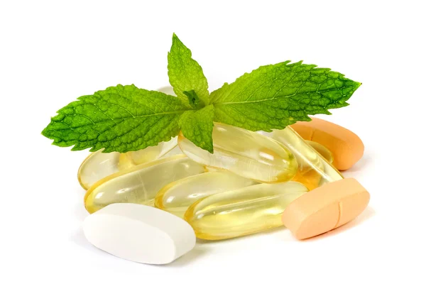 Supplements with a mint leaves Stock Photo