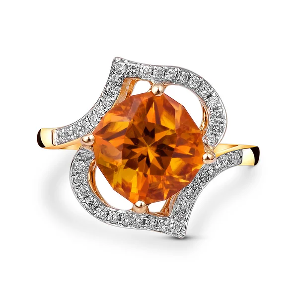 Yellow gold ring with orange gemstone Stock Photo