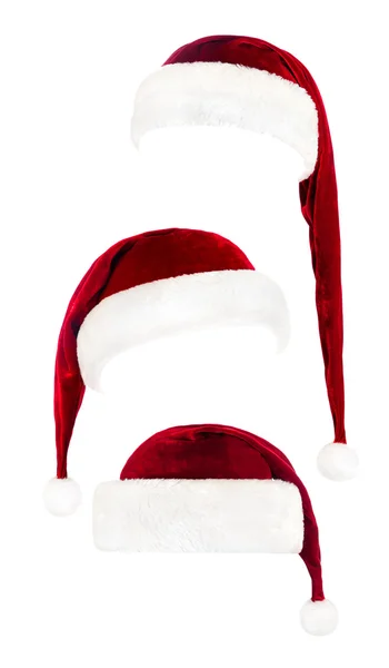 Conjunto de chapéus vermelhos Papai Noel isolados em branco — Fotografia de Stock
