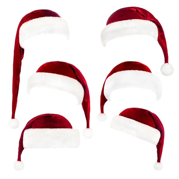 Conjunto de chapéus vermelhos Papai Noel isolados em branco Fotos De Bancos De Imagens