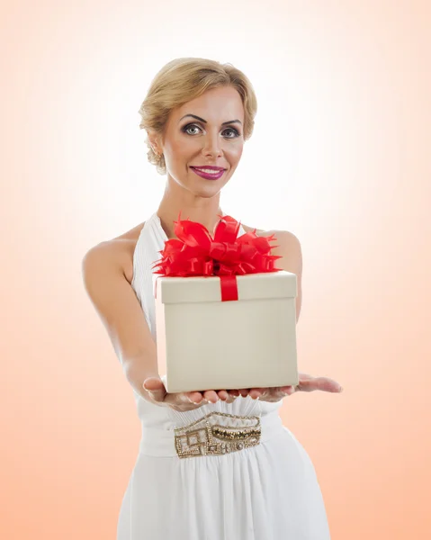 Young happy woman with a gift — Stock Photo, Image