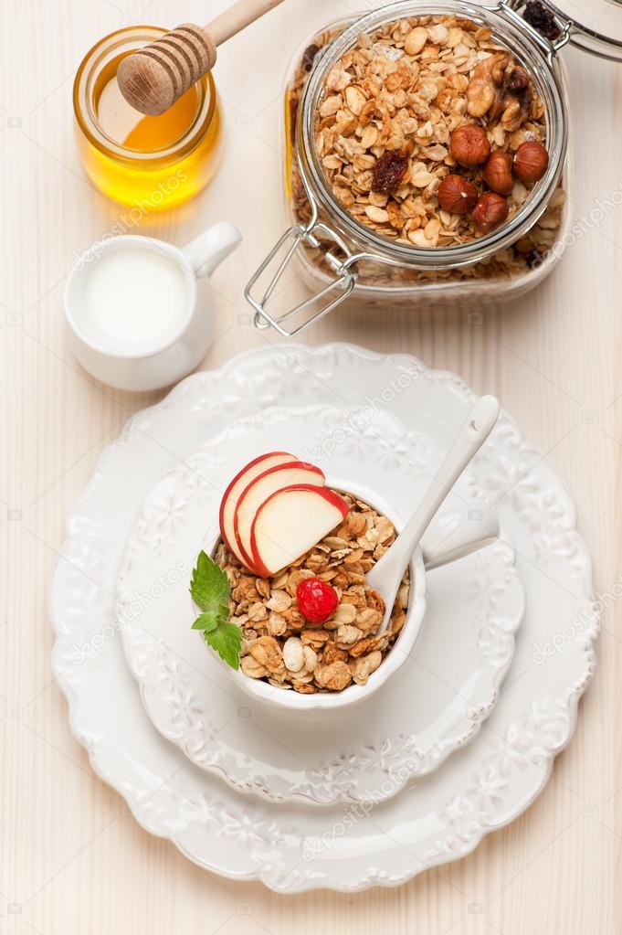 Granola muesli with honey and milk. Healthy breakfast. Stock Photo by
