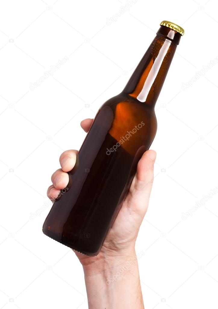 brown beer bottle in hand isolated on white background