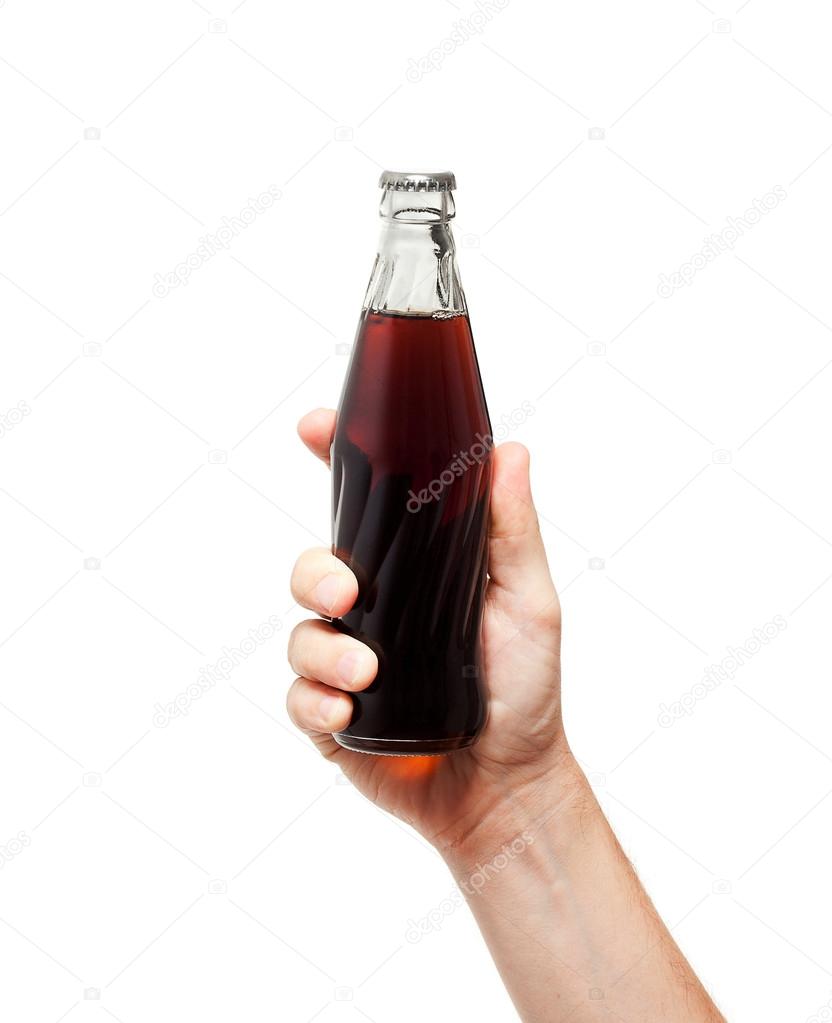 soda water bottle in hand isolated on white background