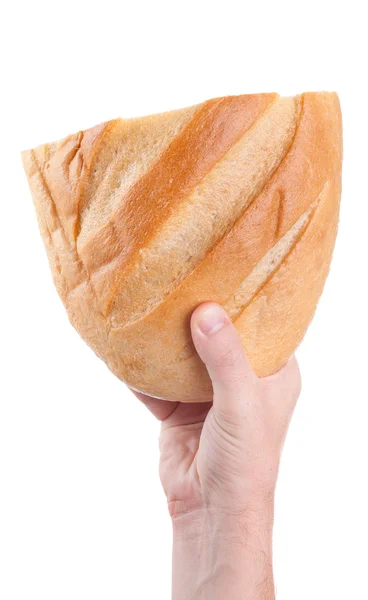 Чоловік тримає свіжий хліб в руках, ізольований на білому тлі Стокове Фото