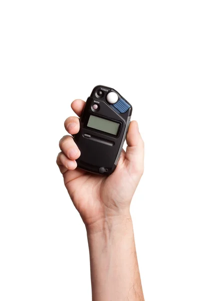 Medidor de flash na mão sobre fundo branco — Fotografia de Stock