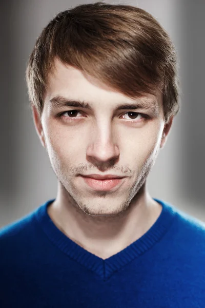 Portrait of a handsome young man in the studio — Stock Photo, Image