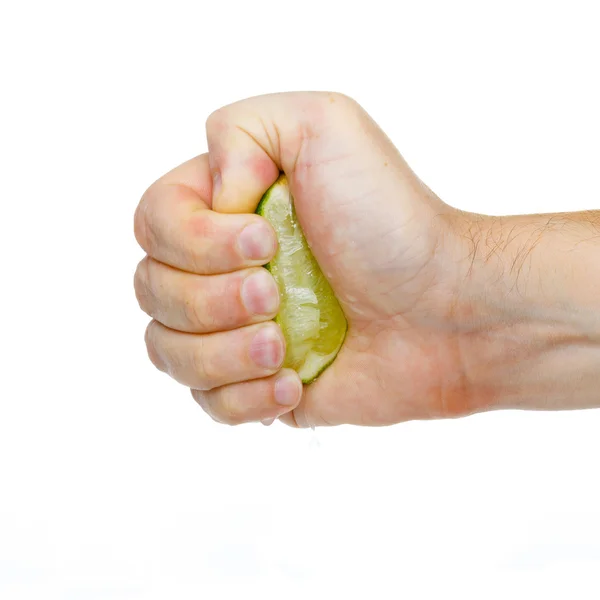 Kalk in der Hand isoliert auf weißem Hintergrund — Stockfoto