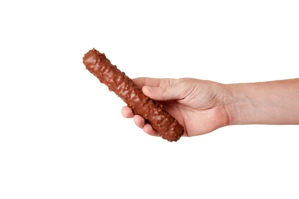 Barre de chocolat avec des noix à la main isolé sur fond blanc — Photo