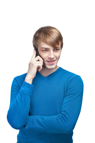 Ung man i blå pullover isolerad på en vit bakgrund talkin — Stockfoto