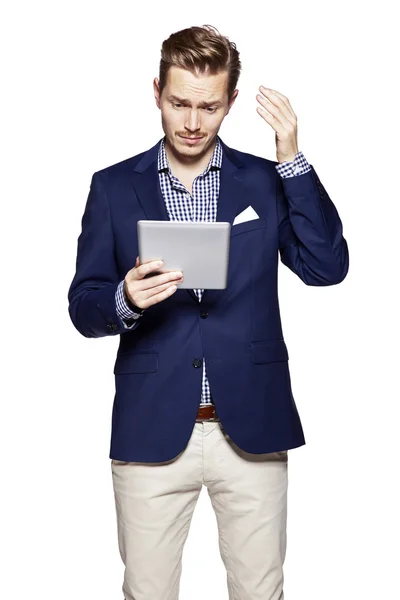 Worried man using digital tablet — Stock Photo, Image