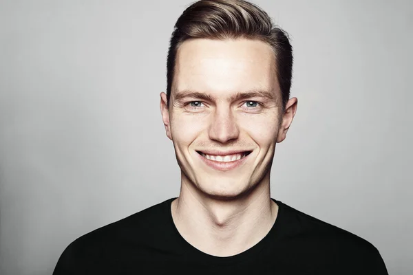 Young handsome man smiling to you — Stock Photo, Image