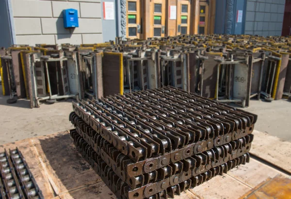 The old part of the escalator stacked in front of a replacement