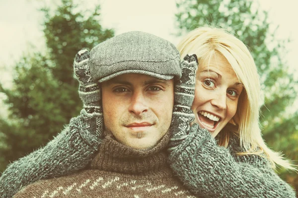 Couple having some fun on a autumn day — Stock Photo, Image