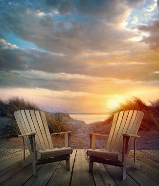 Wooden deck with chairs, sand dunes and ocean clipart