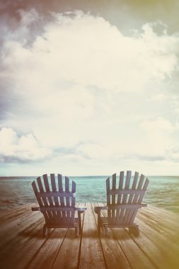Adirondack chairs on dock with vintage textures and feel clipart