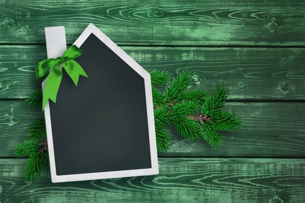 House shaped chalkboard on Christmas background — Stock Photo, Image