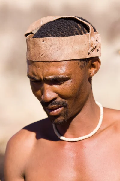 San man in native settlement — Stock Photo, Image