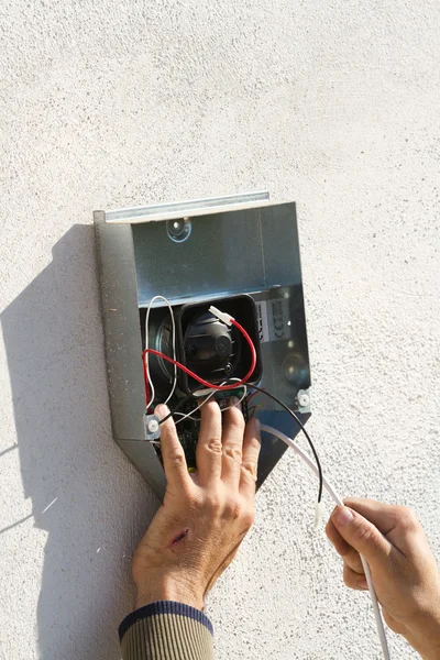 Electrician fixing equipment — Stock Photo, Image