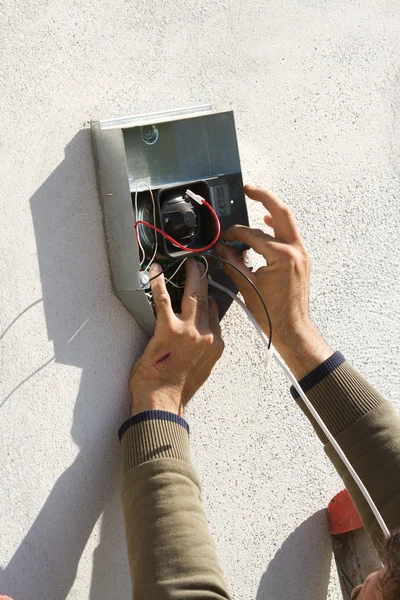 Electrician fixing equipment — Stock Photo, Image