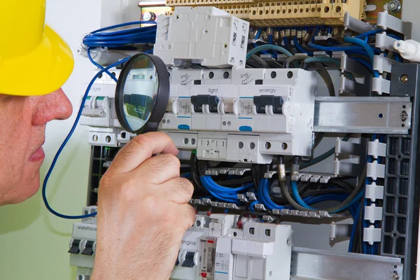 Electrician working indoors Stock Picture