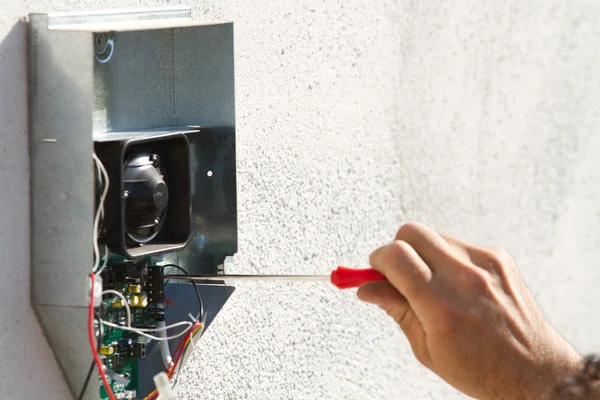 Electrician fixing equipment — Stock Photo, Image