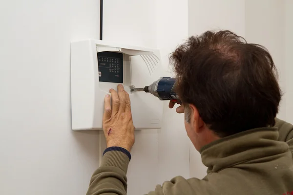 Electrician fixing equipment — Stock Photo, Image