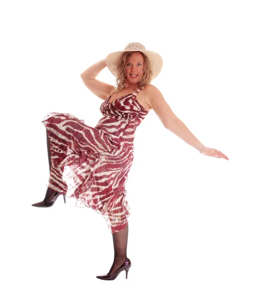 Woman dancing in dress and hat. — Stock Photo, Image