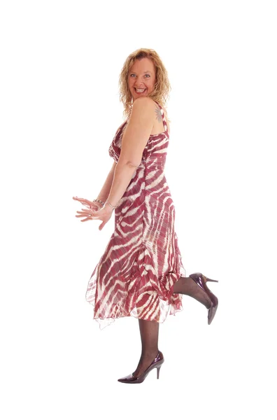 Happy blond woman dancing in dress. — Stock Photo, Image