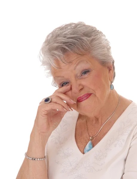 Senior woman holding hand on her face. — Stock Photo, Image