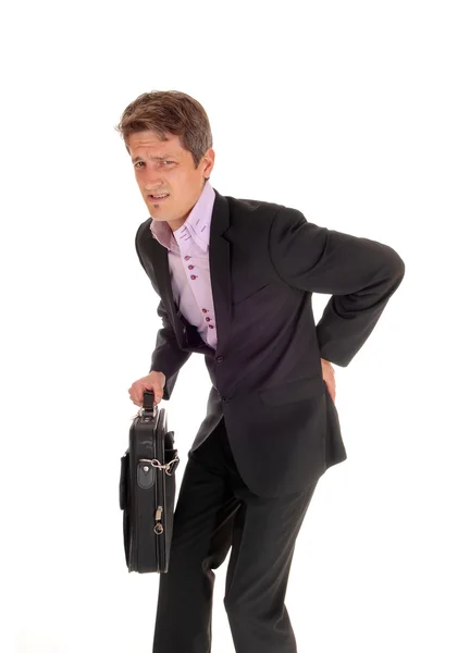 Businessman walking with back pain. — Stock Photo, Image