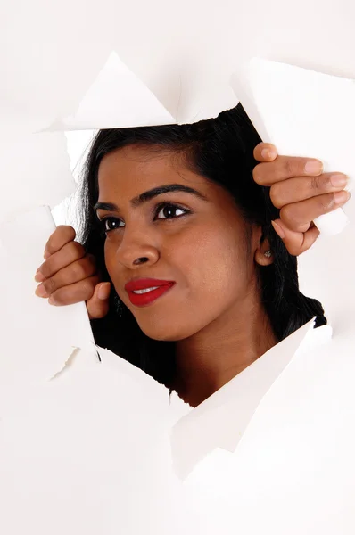 Woman looking through a paper howl. — Stock Photo, Image