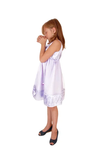 Young girl praying. Stock Picture