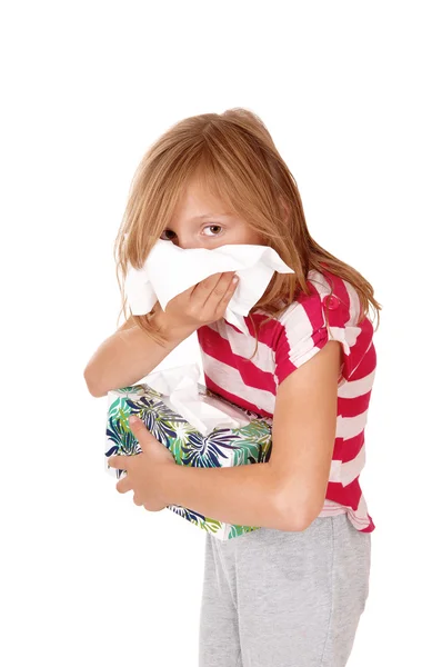 Girl blowing her nose. — Stock Photo, Image