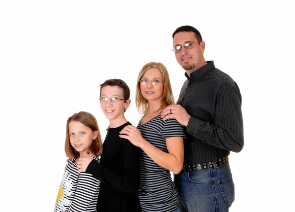 Family standing in profile. — Stock Photo, Image