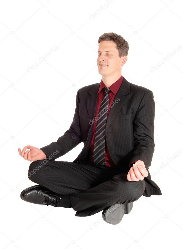 Businessman doing yoga.