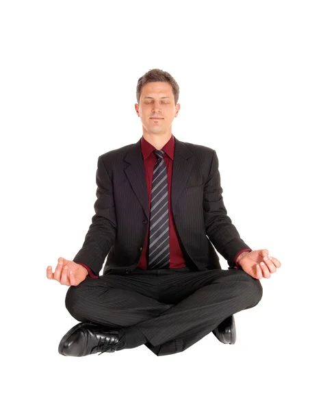 Businessman doing yoga. — Stock Photo, Image