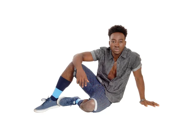 Black man sitting on floor. — Stock Photo, Image