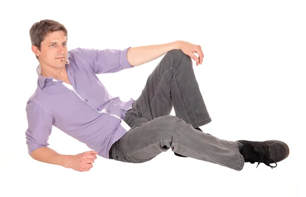 Young man sitting on floor. — Stock Photo, Image